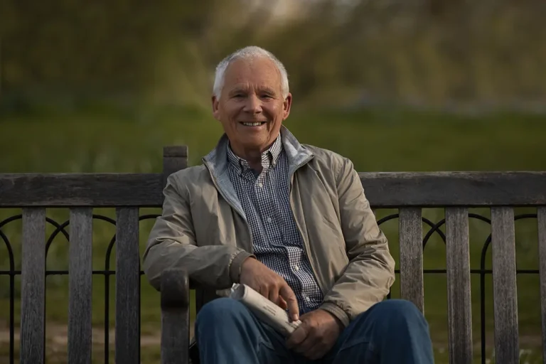 Senior Man Sitting on Bench - Learn About the Health Benefits of NAD+