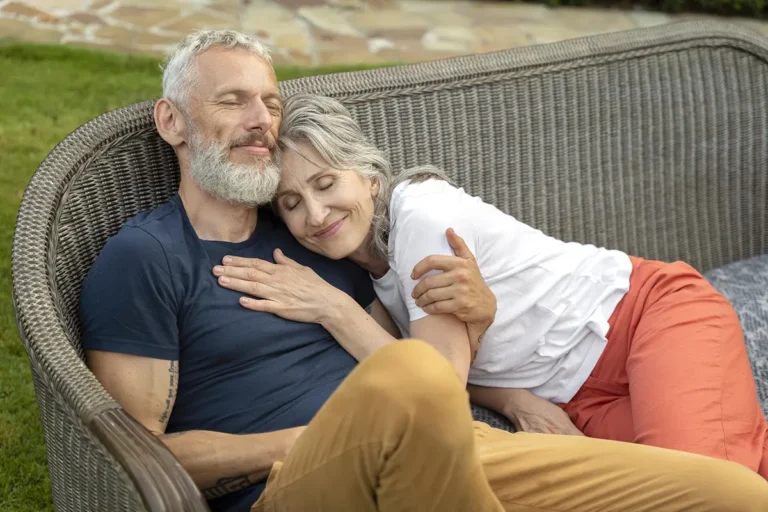 Smiling Senior Couple on Bench - Exploring Cialis Benefits Beyond Erectile Dysfunction