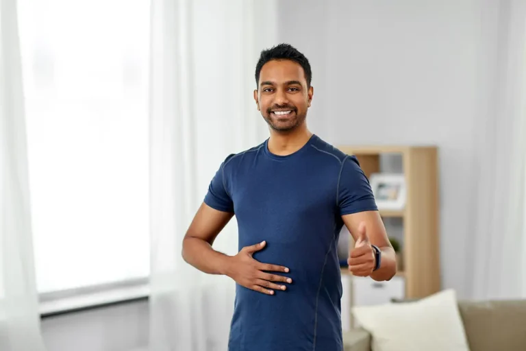 Why Gut Health Matters, Indian man with fitness tracker showing thumbs up
