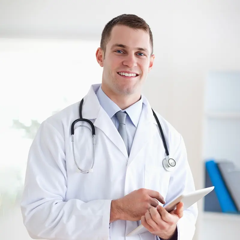Close up of a smiling doctor with notes